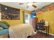 Bedroom with a double bed, backyard access, and a workspace at 22247 Red Jacket Ln, Land O Lakes, FL 34639