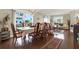 Elegant dining room with hardwood floors, a large table, and a chandelier at 22247 Red Jacket Ln, Land O Lakes, FL 34639