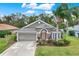 Well maintained house with a landscaped front yard at 22247 Red Jacket Ln, Land O Lakes, FL 34639