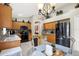 Open kitchen boasts granite counters, stainless steel appliances, and wood cabinets at 22247 Red Jacket Ln, Land O Lakes, FL 34639