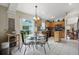 Kitchen features breakfast nook, wood cabinets, and view to Gathering room at 22247 Red Jacket Ln, Land O Lakes, FL 34639