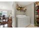 Convenient laundry room with washer, dryer and storage at 22247 Red Jacket Ln, Land O Lakes, FL 34639