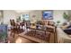 Open living and dining area with hardwood floors, comfortable seating, and a dining table at 22247 Red Jacket Ln, Land O Lakes, FL 34639
