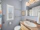 Clean bathroom with shower, grab bars, and updated vanity at 3907 William Hume Dr, Zephyrhills, FL 33541