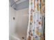 Bathroom with tub and shower, and a colorful shower curtain at 3907 William Hume Dr, Zephyrhills, FL 33541