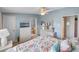 Bright bedroom featuring a king-size bed and en-suite bathroom at 3907 William Hume Dr, Zephyrhills, FL 33541