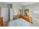 Well-lit bedroom with a full bed and mirrored closet at 3907 William Hume Dr, Zephyrhills, FL 33541