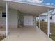 Spacious carport with double doors for storage at 3907 William Hume Dr, Zephyrhills, FL 33541
