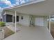 Covered carport with access to home and storage at 3907 William Hume Dr, Zephyrhills, FL 33541