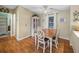 Small dining area with wooden table and chairs near kitchen at 3907 William Hume Dr, Zephyrhills, FL 33541