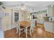 Casual dining area with wood flooring and a table for four at 3907 William Hume Dr, Zephyrhills, FL 33541