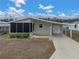 Mobile home with carport and landscaped yard at 3907 William Hume Dr, Zephyrhills, FL 33541