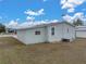 Single-wide manufactured home with a large yard at 3907 William Hume Dr, Zephyrhills, FL 33541