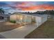 Single-story home with carport and screened porch at 3907 William Hume Dr, Zephyrhills, FL 33541
