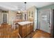 Kitchen with island and access to dining area and exterior door at 3907 William Hume Dr, Zephyrhills, FL 33541