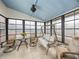 Bright sunroom with seating, a swing, and view of the outdoors at 3907 William Hume Dr, Zephyrhills, FL 33541
