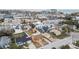 Aerial view showcasing a house and surrounding neighborhood near the coast at 440 77Th Ave, St Pete Beach, FL 33706