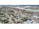 Aerial view of a neighborhood near the waterfront, featuring houses and streets at 440 77Th Ave, St Pete Beach, FL 33706
