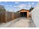 Single car garage with wooden walls and a concrete floor at 440 77Th Ave, St Pete Beach, FL 33706