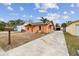Bright orange house with a driveway and mailbox at 440 77Th Ave, St Pete Beach, FL 33706