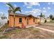 House exterior with walkway and palm trees at 440 77Th Ave, St Pete Beach, FL 33706