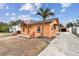Front view of a single story house with a driveway and landscaping at 440 77Th Ave, St Pete Beach, FL 33706