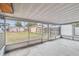 Screened porch with view of backyard at 440 77Th Ave, St Pete Beach, FL 33706