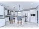 Modern kitchen with white cabinets and granite island at 4424 Tevalo Dr, Valrico, FL 33596