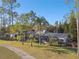 Single-Gathering home with a large backyard and lush landscaping at 5474 Kemkerry Rd, Wesley Chapel, FL 33543