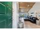 Inviting entryway with green door opening to a living area at 5474 Kemkerry Rd, Wesley Chapel, FL 33543