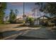 House exterior with stone accents and a circular driveway at 5474 Kemkerry Rd, Wesley Chapel, FL 33543