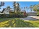 House exterior showcasing a two-car garage and manicured lawn at 5474 Kemkerry Rd, Wesley Chapel, FL 33543