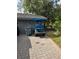 Attached garage with golf cart and paved driveway at 5474 Kemkerry Rd, Wesley Chapel, FL 33543