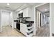 Modern kitchen with white cabinets, granite countertops, and stainless steel appliances at 5474 Kemkerry Rd, Wesley Chapel, FL 33543