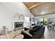 Spacious living room features a fireplace and vaulted ceilings at 5474 Kemkerry Rd, Wesley Chapel, FL 33543