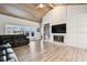 Spacious living room with vaulted ceiling, fireplace, and hardwood floors at 5474 Kemkerry Rd, Wesley Chapel, FL 33543