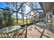 Spacious screened patio overlooking a lush green golf course at 5474 Kemkerry Rd, Wesley Chapel, FL 33543