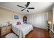 Bright bedroom with wood floors, double closet, and ceiling fan at 587 Hillcrest Dr, Largo, FL 33771