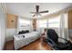 Bedroom with hardwood floors, ceiling fan and window at 587 Hillcrest Dr, Largo, FL 33771