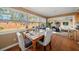 Bright dining area with wood table and view of backyard at 587 Hillcrest Dr, Largo, FL 33771