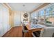 Dining room features a wood table and hardwood floors at 587 Hillcrest Dr, Largo, FL 33771