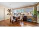 Bright dining room with wood table and hardwood floors at 587 Hillcrest Dr, Largo, FL 33771