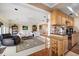 Open concept kitchen and living area with granite counters and hardwood floors at 587 Hillcrest Dr, Largo, FL 33771