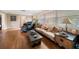 Living area featuring hardwood floors, comfy seating, and a coffee table at 587 Hillcrest Dr, Largo, FL 33771