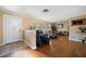 Living room with hardwood floors, comfortable seating, and large windows at 587 Hillcrest Dr, Largo, FL 33771