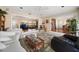 Open floor plan living area with views into kitchen and dining area at 587 Hillcrest Dr, Largo, FL 33771