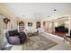 Open concept living area with hardwood floors and views into kitchen at 587 Hillcrest Dr, Largo, FL 33771