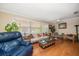 Spacious living room with hardwood floors and ample natural light at 587 Hillcrest Dr, Largo, FL 33771