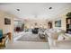 Open living space with access to patio, featuring comfy seating and area rug at 587 Hillcrest Dr, Largo, FL 33771