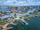 Aerial view showcasing canal-front home and neighborhood at 635 115Th Ave, Treasure Island, FL 33706